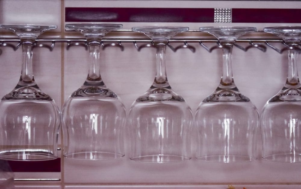 (A small kitchen can be a tough customer, but a rack like this one for holding glassware can save space.