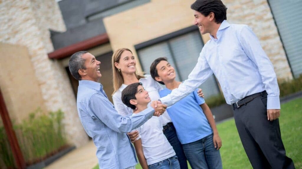 a Family Looking at a House with a Real Estate Agent | Ottawa Property Shop